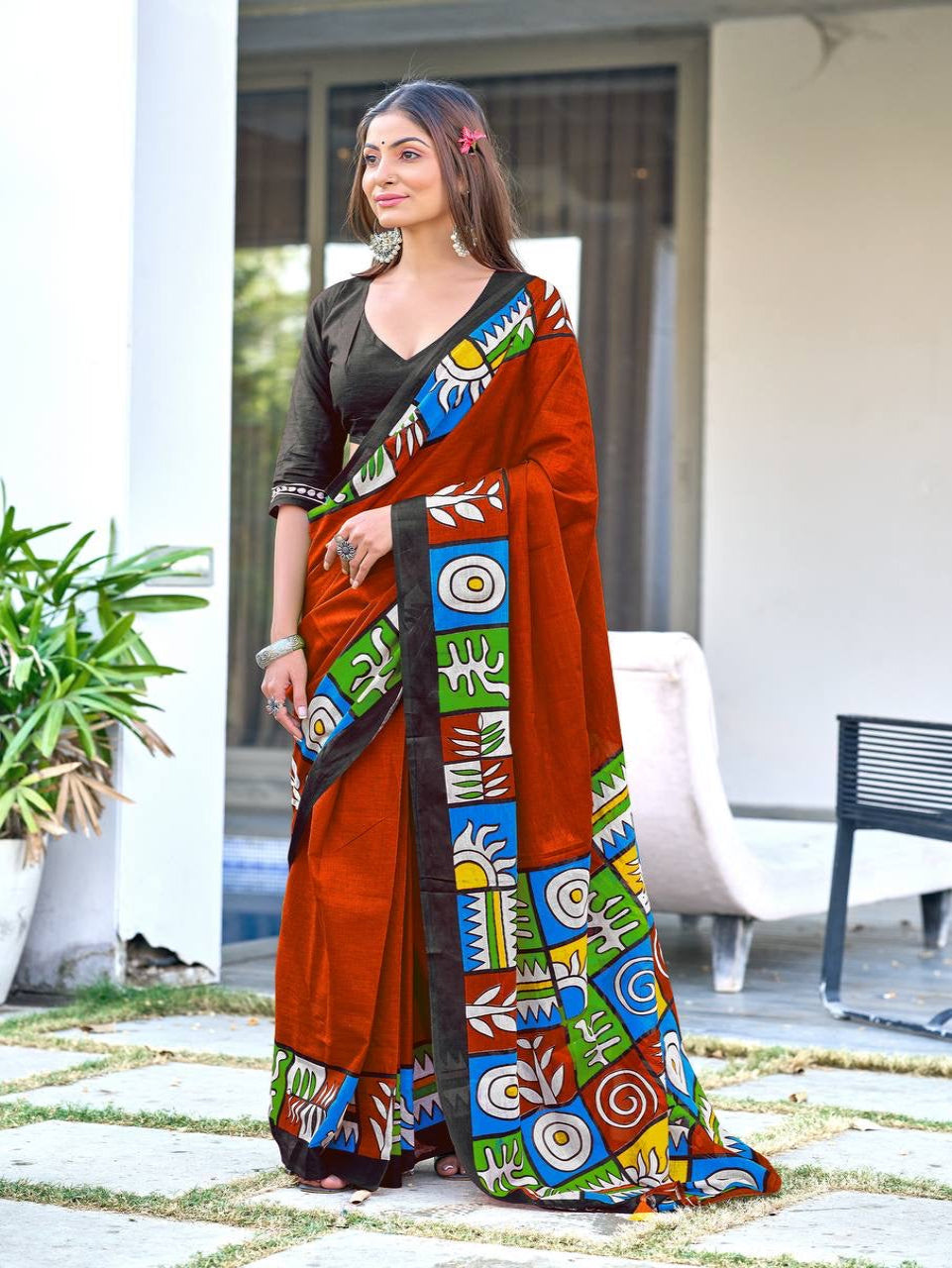 Rust Orange Cotton Saree with Vibrant Folk-Inspired Border